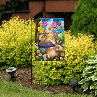 Briarwood Lane Spring Bunny Basket Garden Flag with colorful bunnies and flowers on display outdoors.