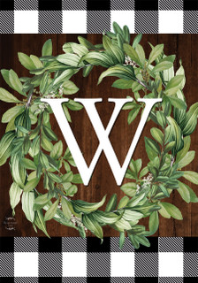 Briarwood Lane Wreath Monogram W Garden Flag with greenery and checkered border on wooden background.