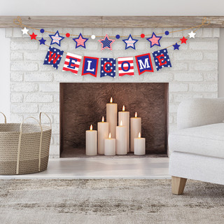 Briarwood Lane patriotic USA string banner hanging above candles in a festive holiday home display.