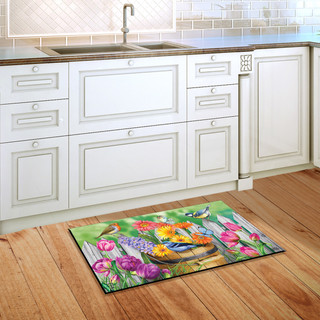 Briarwood Lane Birds and Blooms colorful doormat with birds and flowers on kitchen floor.