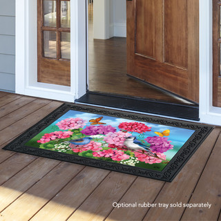 Briarwood Lane Geraniums In Bloom doormat with blue jay, butterflies, and colorful flowers on porch.