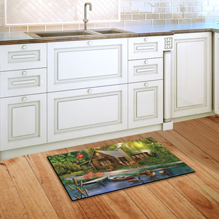Briarwood Lane Lakeside Cabin Summer Doormat on a kitchen floor with a colorful cabin scene.