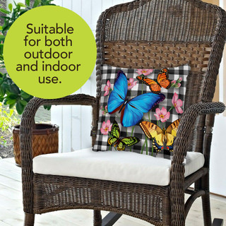 Briarwood Lane checkered butterfly spring decorative pillow on wicker chair outdoor colorful cheerful seasonal display.