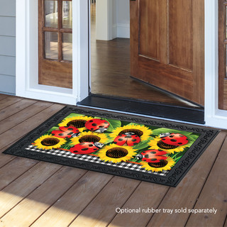 Briarwood Lane Ladybugs And Sunflowers summer doormat with checkered border on a wooden porch floor.