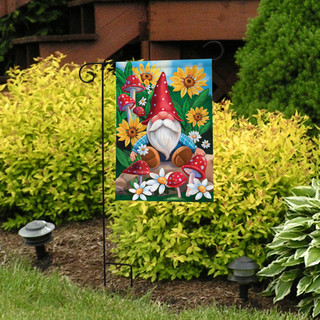 Briarwood Lane gnome garden flag with colorful flowers, sunflowers, and mushrooms on a sunny lawn display.
