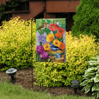 Briarwood Lane spring garden flag with colorful tulips, flowers, and birds on a decorative outdoor display.
