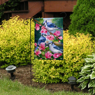 Briarwood Lane Blue Jay Trio garden flag with pink flowers and blue jays on a stand.