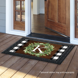 Briarwood Lane monogrammed letter K doormat on wooden floor with black and white checkered border.