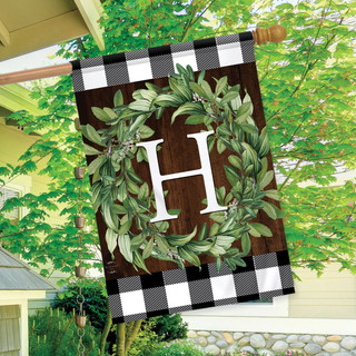 Briarwood Lane double-sided house flag with monogrammed greenery wreath on plaid background for porch display.