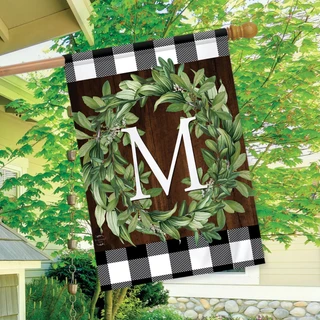Briarwood Lane monogrammed house flag with greenery wreath on plaid background for farmhouse porch decor.