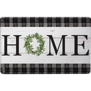 Briarwood Lane Home Comfort Mat with green wreath and black plaid border, white wood background.