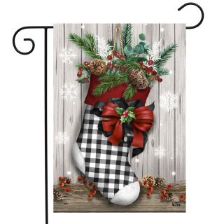 Briarwood Lane Christmas Stocking Garden Flag with black and white checkered stocking and red bow decoration.