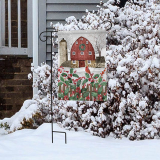 Briarwood Lane Barn in Snow garden flag with red barn, holly, and cardinal on display outdoors.