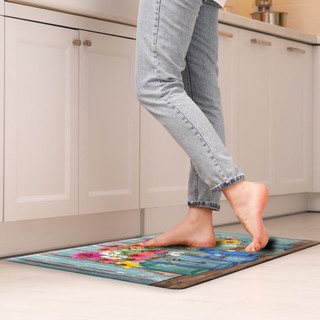 Briarwood Lane Farm Fresh Flowers Comfort Mat with colorful floral design under bare feet in kitchen.