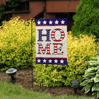 Briarwood Lane American Home Burlap Garden Flag with patriotic design and HOME text on stand outdoors.