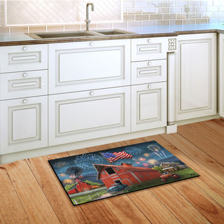 Briarwood Lane American Celebration Barn doormat on wooden floor in front of white kitchen cabinets.
