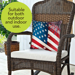Briarwood Lane Stars and Stripes Pillow on wicker chair with white cushion, red, white, and blue.
