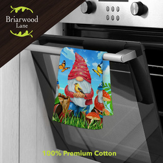 Briarwood Lane Gnome Sweet Gnome cotton hand towel with colorful garden gnome design hanging on oven handle.