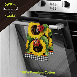 Briarwood Lane Ladybugs and Sunflowers cotton hand towel, 100% premium cotton, hanging on oven handle.
