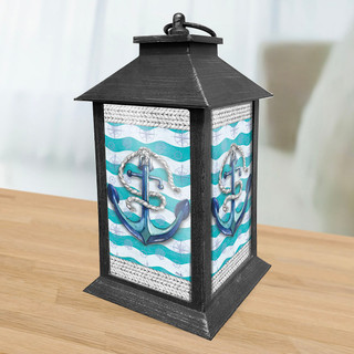 Briarwood Lane Welcome Anchor Lantern with nautical anchor design on turquoise and white wavy background.