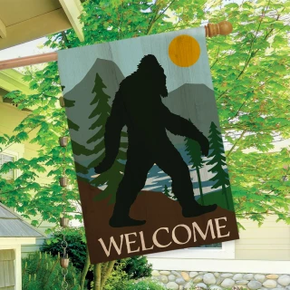 Briarwood Lane Bigfoot Welcome House Flag with silhouette of Bigfoot and forest scenery design.