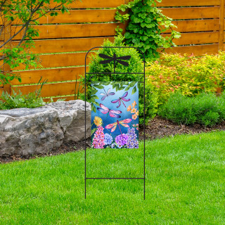 Briarwood Lane wrought iron dragonfly garden flag arbor with colorful butterfly design on green lawn.