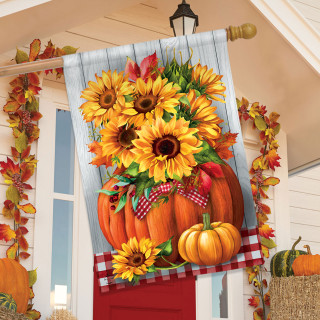 Sunflowers in Pumpkin House Flag with red and white checkered ribbon on orange pumpkins and sunflowers.