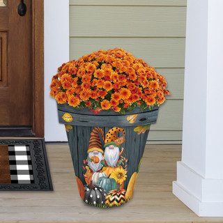 Large gray Fall Gnomes planter with vibrant orange flowers and autumnal gnome design on porch step.