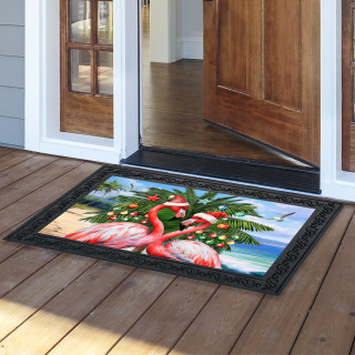 Festive Flamingos doormat with pink flamingos palm tree and beach scene on a black background.