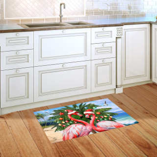 Festive Flamingos Doormat with pink flamingos, palm tree, and beach scene on wooden kitchen floor.