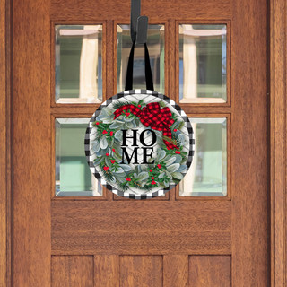 Round Winter Wreath Wood Door Hanger with red berries and Home text on a wooden door.