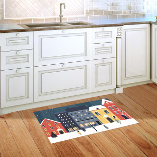 Snow Day Doormat on wooden floor in front of white kitchen cabinets with colorful winter scene.