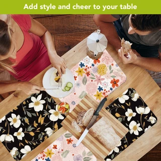 Bold Florals Placemat set of 4, colorful floral designs on black and pink backgrounds, table setting.