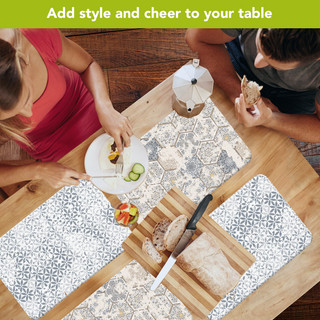 Distressed Elegance Placemats, 4-pack, on a table with a wooden cutting board and food.