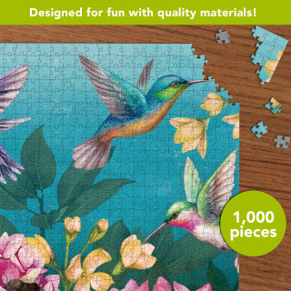 Springtime Hummingbirds 1000 Piece Jigsaw Puzzle with colorful hummingbirds, flowers, and green leaves on blue.