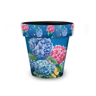 Colorful Hydrangeas small planter with blue, pink, and yellow flowers on a blue background.