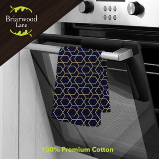Blue geometric cotton hand towel with yellow lines, hanging on oven door handle, Briarwood Lane brand.