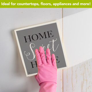 Home Sweet Home Natural Fiber Swedish Dishcloth, pink glove holding gray and white sign on tile.