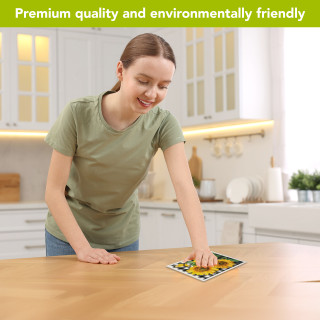 Woman wiping kitchen table with Checkered Sunflowers Summer Swedish Dishcloth, green and yellow sunflower design.