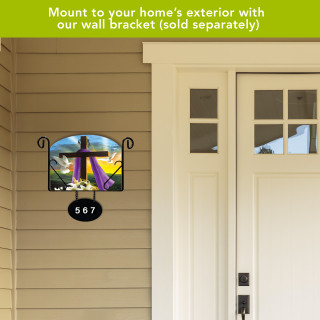 Easter Sunrise Religious Acrylic Art Sign with colorful cross on beige siding next to front door.