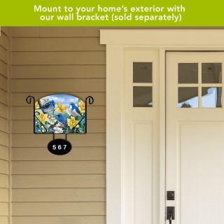 Bluebirds and Daffodils acrylic art sign with house number 567 on exterior wall bracket.