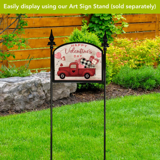 Red truck Valentine's Day acrylic garden sign with pink hearts and plaid flowers on stand outdoors.