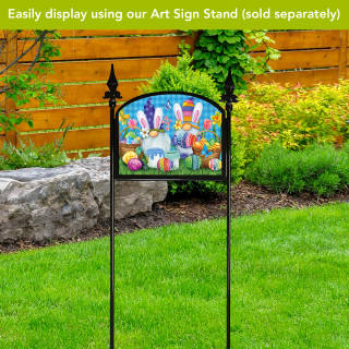 Easter Gnomes Acrylic Art Sign on stand with colorful Easter bunnies and eggs outdoors.