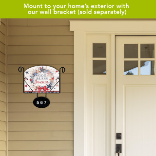 American Wreath Acrylic Art Sign with floral design and house number 567 on exterior wall.