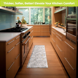 Distressed Tiles Oversized Comfort Mat in kitchen with wood cabinets and white countertops on hardwood floor.
