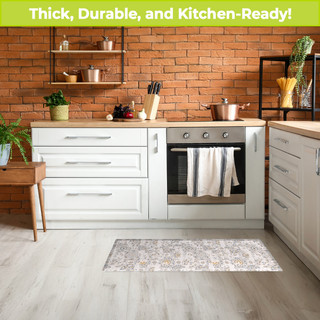 Distressed Tiles Oversized Comfort Mat in kitchen setting with white cabinets and brick wall backdrop.
