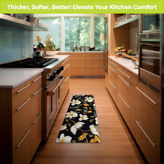 Elegant Flowers Oversized Comfort Mat in black with white and yellow flowers on kitchen floor.