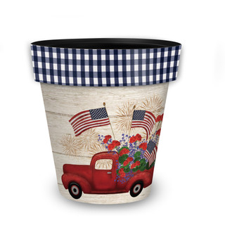 Stars and Stripes Truck Medium Planter with red truck, flowers, and American flags on white background.