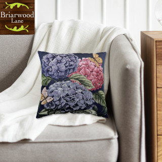 Colorful Hydrangeas Indoor Pillow with purple, pink, and green floral design on a dark background.