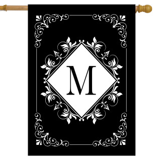 Black and white monogram house flag with M, double-sided, ornate floral design on gold pole.
